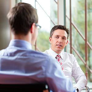 coaching-management-38638423-300px Interview between business men