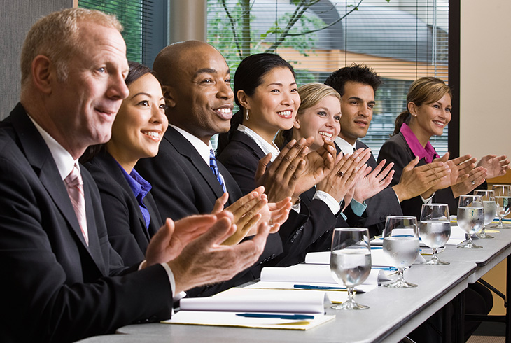 Group of business people applauding